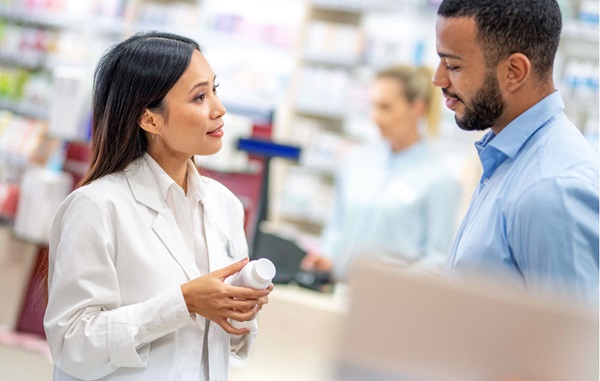 Pharmacist helping a patient with a medication